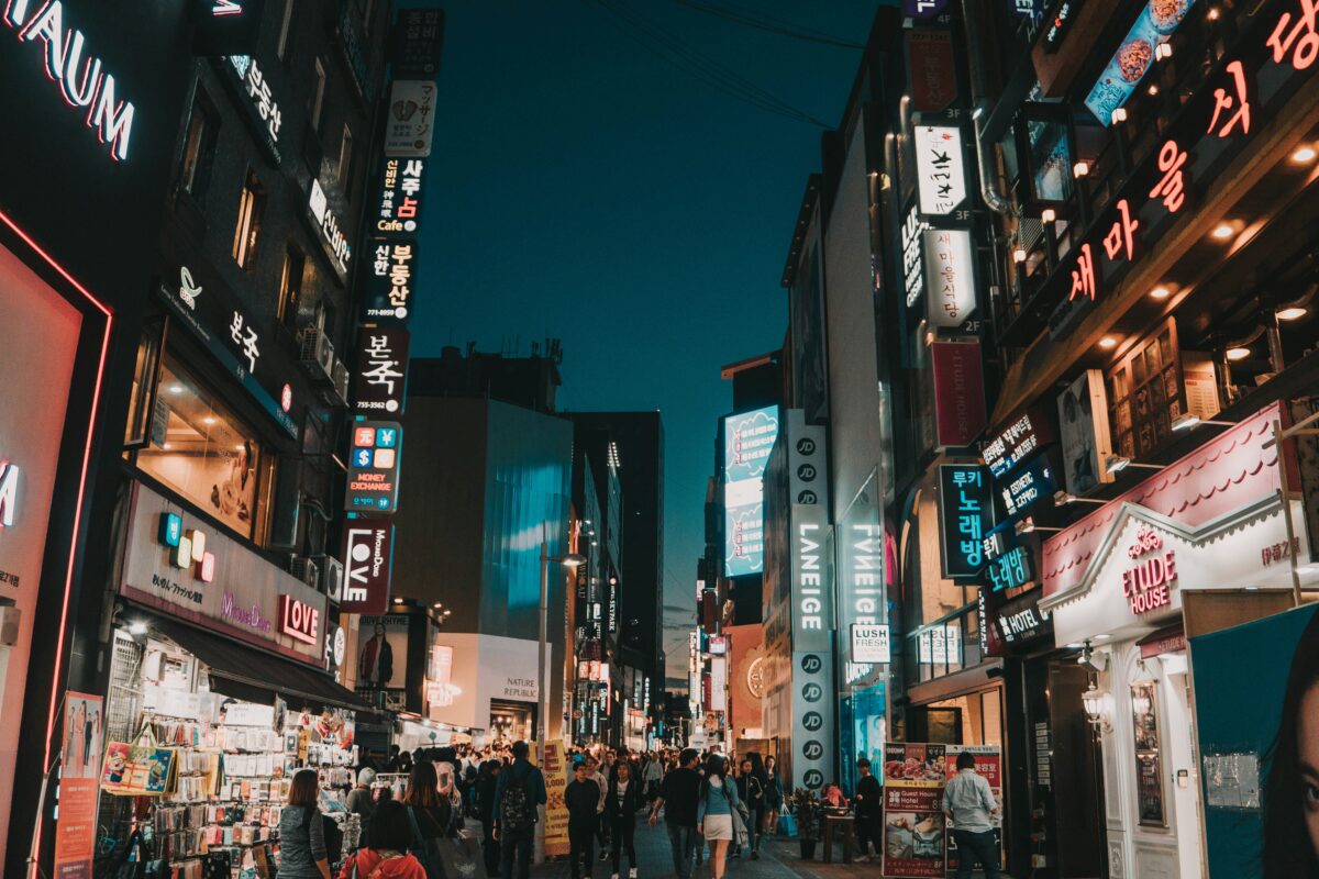 Colorful Korean street signs and hangul writing in a busy Seoul city neighborhood